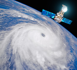Research, probing, monitoring typhoon. Satellite above the Earth makes measurements of the weather parameters. Elements of this image furnished by NASA. © aapsky