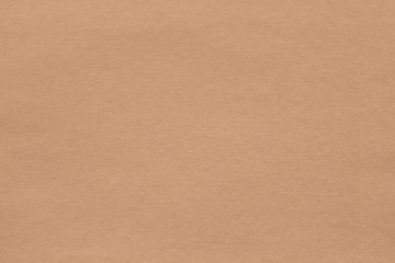 light brown paper texture background. colored cardboard fibers and grain. empty space concept.