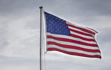 American flag and clouds