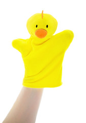 Yellow chicken glove puppet controlled by the hand isolated on white background. Hand puppet toy with hand inside. Soft toy for puppet show for story telling or enacting the role play activities.