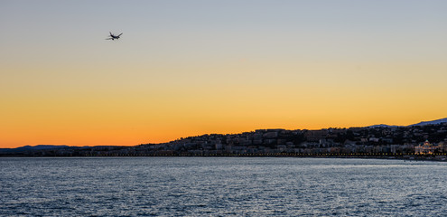 Cote d'azur, France. Beautiful sunset view of city of Nice. Luxury resort of French riviera. Front view of the Mediterranean sea, the bay of Angels