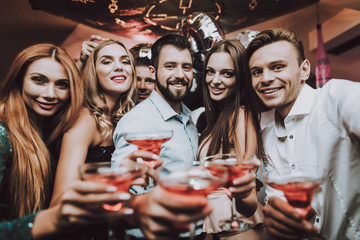 Friends. Nightclub. Cocktails. Beautiful Outfits .