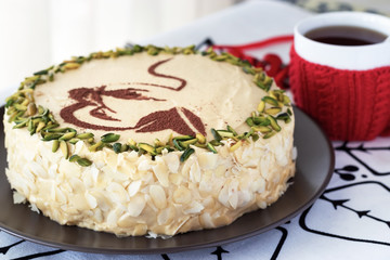Mocha coffee cake with butter cream, pistachio. White background. Cozy christmas concept.