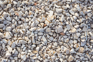 Stone background texture on the beach, top view
