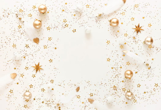 Christmas background pattern from gold and white Christmas decorations . Xmas composition of New Year's Christmas balls. Winter holiday concept.Flat lay. Top view. Copy space
