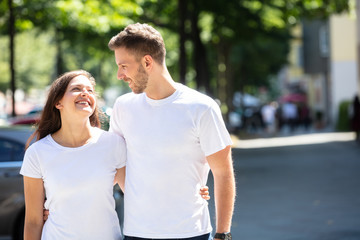 Happy Couple Standing On Street