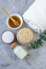 Natural Ingredients Homemade Body Oatmeal Sea Salt Scrub with Olive Oil Honey Milk White Towel Beauty Concept Skincare Organic Aroma Spa Therapy