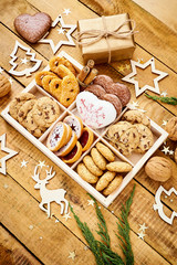 delicious Christmas Eve cookies in a box on an old wooden table