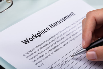 Woman Filling Workplace Harassment Form - obrazy, fototapety, plakaty