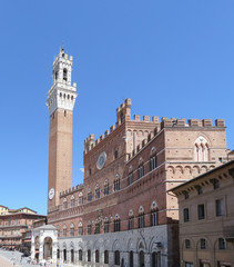 Fototapeta na wymiar Mangia Tower in Piazza del Campo in Siena