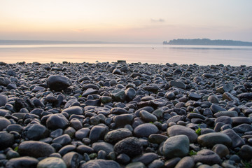 Stones on beach at sunset - 224928620