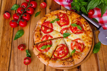 traditional Italian pizza margarita with tomatoes and mozzarella cheese