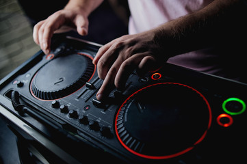 DJ working on mixing board