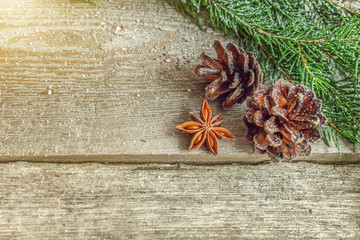 Christmas New Year composition with gift box fir branch pine cones anise on old shabby rustic wooden background. Xmas holiday december decoration to Russian tradition. Flat lay, copy space