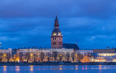 Historical building of Riga Dome Cathedral and Daugava river at night , Latvia. - obrazy, fototapety, plakaty