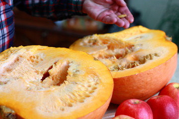 Sliced ​​ripe pumpkin on the kitchen table