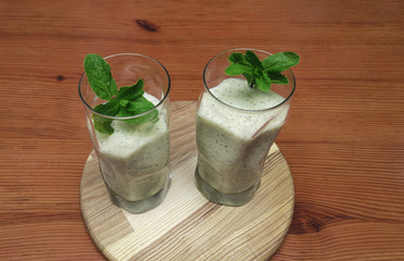 smoothies with fruit in a glass with mint
