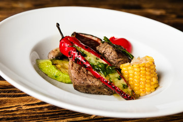 chic delicious steak with vegetable garnish