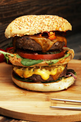 Tasty fresh meat burgers with salad and cheese. Homemade angus burger.