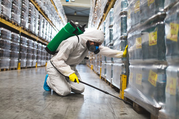 Pest Control Worker Hand Holding Sprayer For Spraying Pesticides in production or manufacturing...