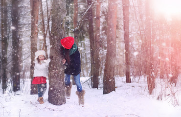 A winter fairy tale, a young mother and her daughter ride a sled