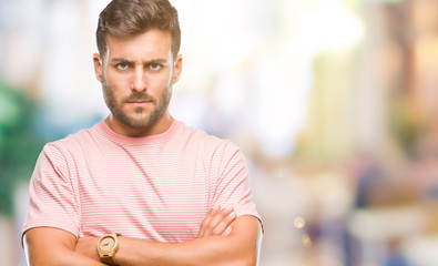 Young handsome man over isolated background skeptic and nervous, disapproving expression on face...