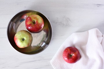 Red apples on a white background