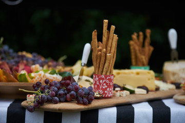 Party table at the garden. Table Food Lunch Variety Outdoors decorations 