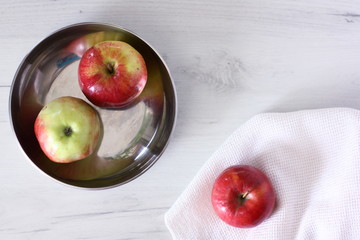 Red apples on a white background