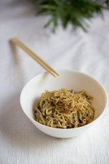 Korean food, soy sprount marinated with garlic and soy sauce on the white backgound