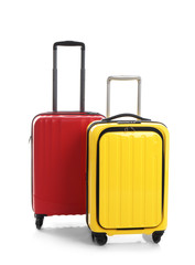 Modern suitcases for travelling on white background