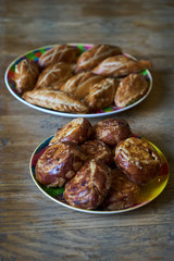 Fresh homemade open patties with cottage cheese and raisins. Traditional Russian pastry vatrushka, round buns, curd tart, top view