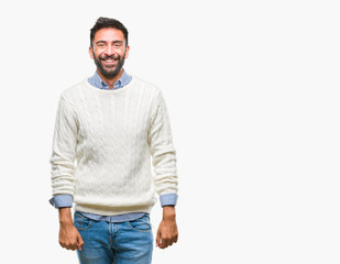Adult hispanic man wearing winter sweater over isolated background with a happy and cool smile on face. Lucky person.