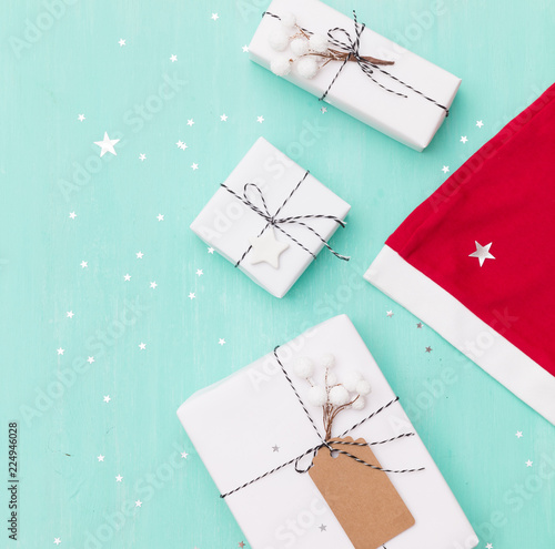 closeup of nice christmas gifts wrapped in white paper christmas tree decorations santas hat - Nice Christmas Gifts closeup of nice christmas gifts wrapped in white paper christmas tree decorations santas hat - Nice Christmas Gifts
