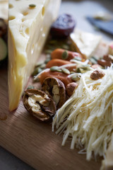 Snacks, fruits and drinks on table, indoors. House party concept. Festive table with food and various dishes, a fresh delicious lunch or beer snack