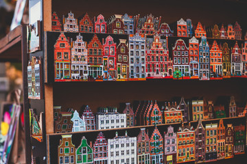 Traditional souvenirs from Amsterdam rows of Delftware porcelain Dutch style houses, Shop window,...