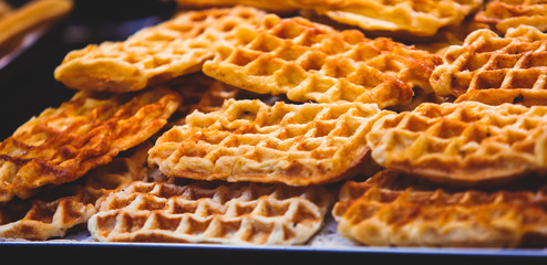 Stroopwafel, stroop wafel, also known as syrup waffle, is one of the famous Dutch snack from The Netherlands, counter with different candy desserts, sweet tasty candy dessert variety in Amsterdam