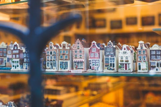 Traditional souvenirs from Amsterdam rows of Delftware porcelain Dutch style houses, Shop window, Netherlands