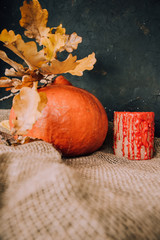  Halloween background. Molten candles. Carrying out the ritual.  Halloween in rustic style. Autumn mood. All hallows' day. Pumpkin, lamp, candles. Harvest. Countryside.