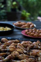 Grilled chicken drumsticks background, close-up. Roasted chicken legs, Cooked with sauce