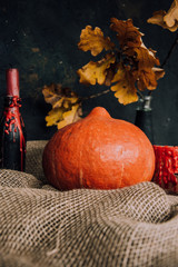  Halloween background. Molten candles. Carrying out the ritual.  Halloween in rustic style. Autumn mood. All hallows' day. Pumpkin, lamp, candles. Harvest. Countryside.