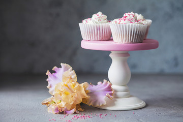 cupcakes with pink frosting and sprinkles
