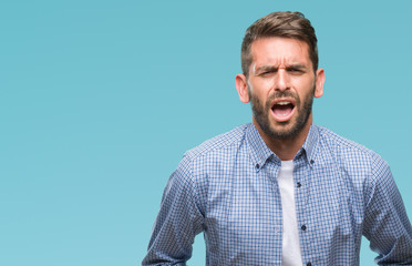 Young handsome man wearing white t-shirt over isolated background with hand on stomach because indigestion, painful illness feeling unwell. Ache concept.