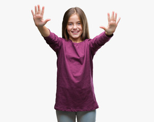 Young beautiful girl over isolated background showing and pointing up with fingers number ten while...
