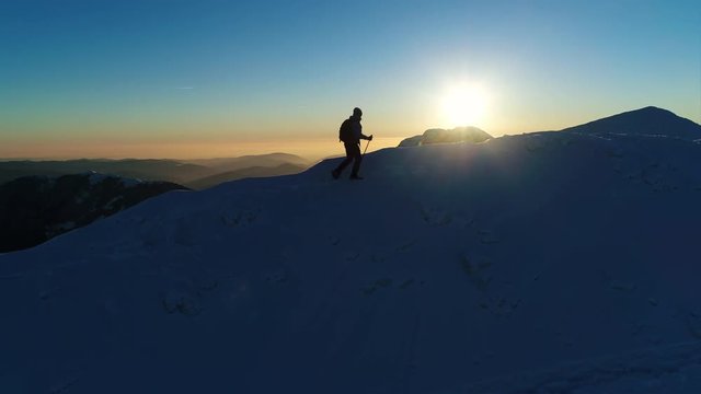Mountaineer exhausted after walking all day in the snowy mountains