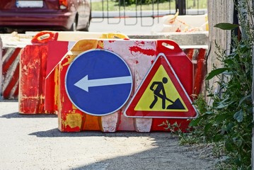 two road signs road works on asphalt