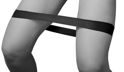 Close-up isolated green sport strap for stretching