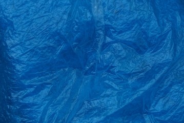 blue plastic texture of crumpled  piece of cellophane