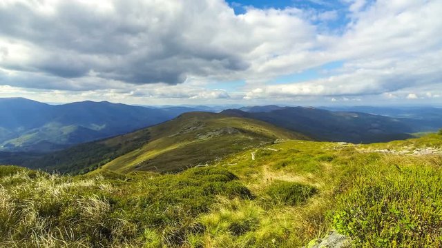 Picturesque landscape of Carpathian mountains in early autumn. View from mount Pikui (1405m). Mount Zelemenyi (1304m) on the background. Carpathians, Ukraine. Time Lapse. 4K UltraHD