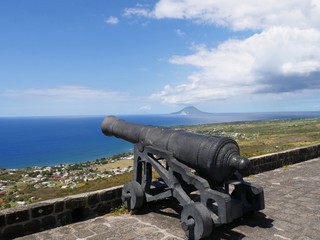 Fototapeta na wymiar One of the cannons mounted on top of the Brimstone Hill Fortress National Park in St. Kitts, Eastern Caribbean